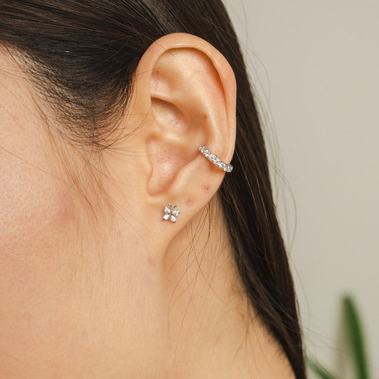 Small sterling silver butterfly studs by BLOOMTINE with 8 total brilliant-cut lab moissanites. These 5mm dainty, tarnish-resistant earrings are an ethical luxury staple, exclusively available at Wolf & Badger and Rackhams, perfect for birthdays and graduations