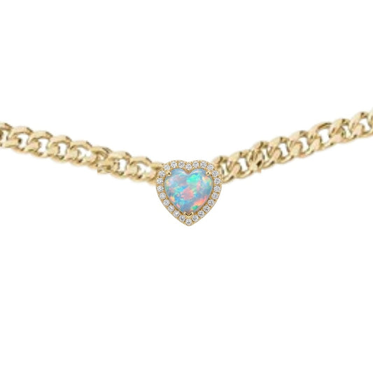 Gold necklace with a heart-shaped blue gemstone on a white background