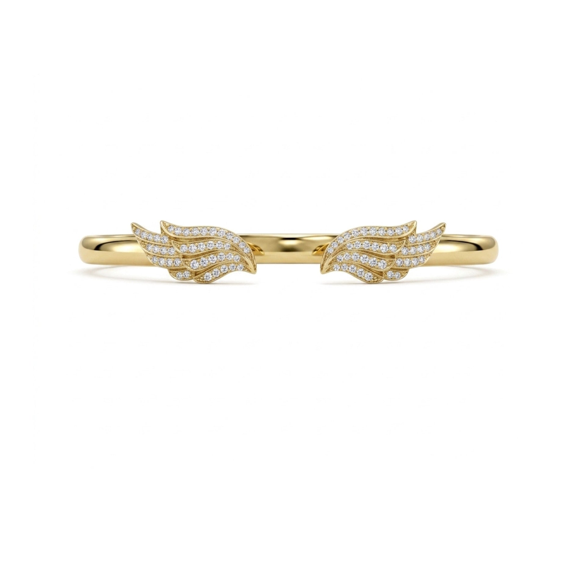 A delicate gold ring featuring two wing-shaped pavé settings, each adorned with small clear stones, shown against a plain white background.