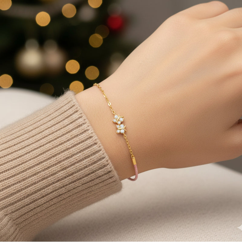 Gold bracelet on a wrist with a blurred festive background