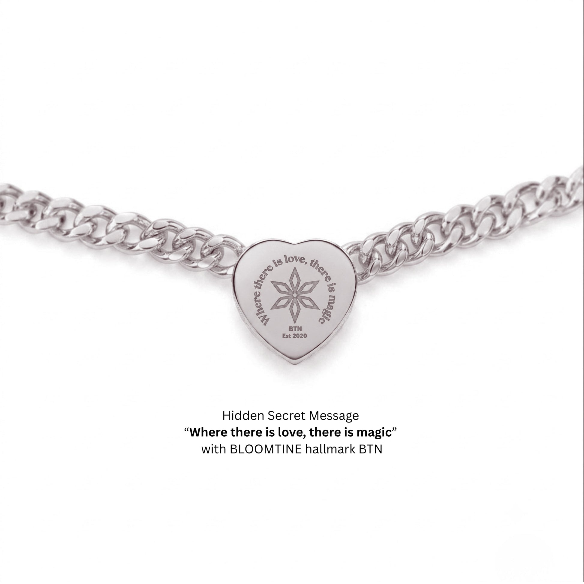 A silver heart-shaped pendant charm on a silver curb chain, featuring the engraved message 'Where there is love, there is magic' and 'BLOOMTINE' with a starburst symbol. Text below reads 'Hidden Secret Message' and 'with BLOOMTINE hallmark BTN'.