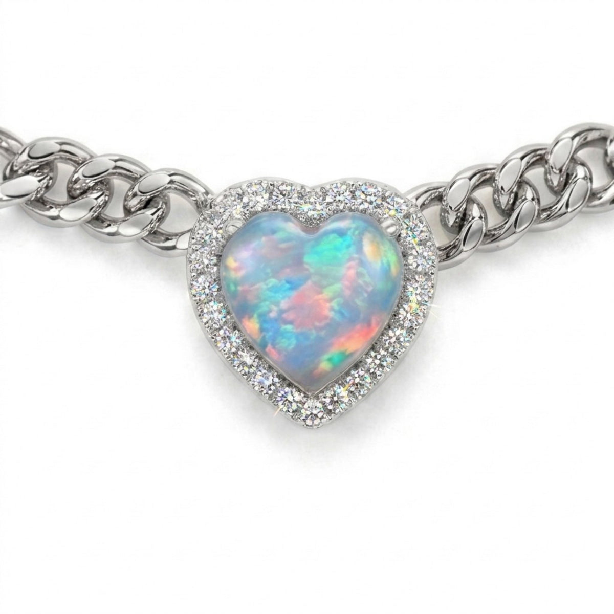 A gold chain bracelet featuring a heart-shaped opal pendant with a halo of small clear stones, shown on a plain white background.