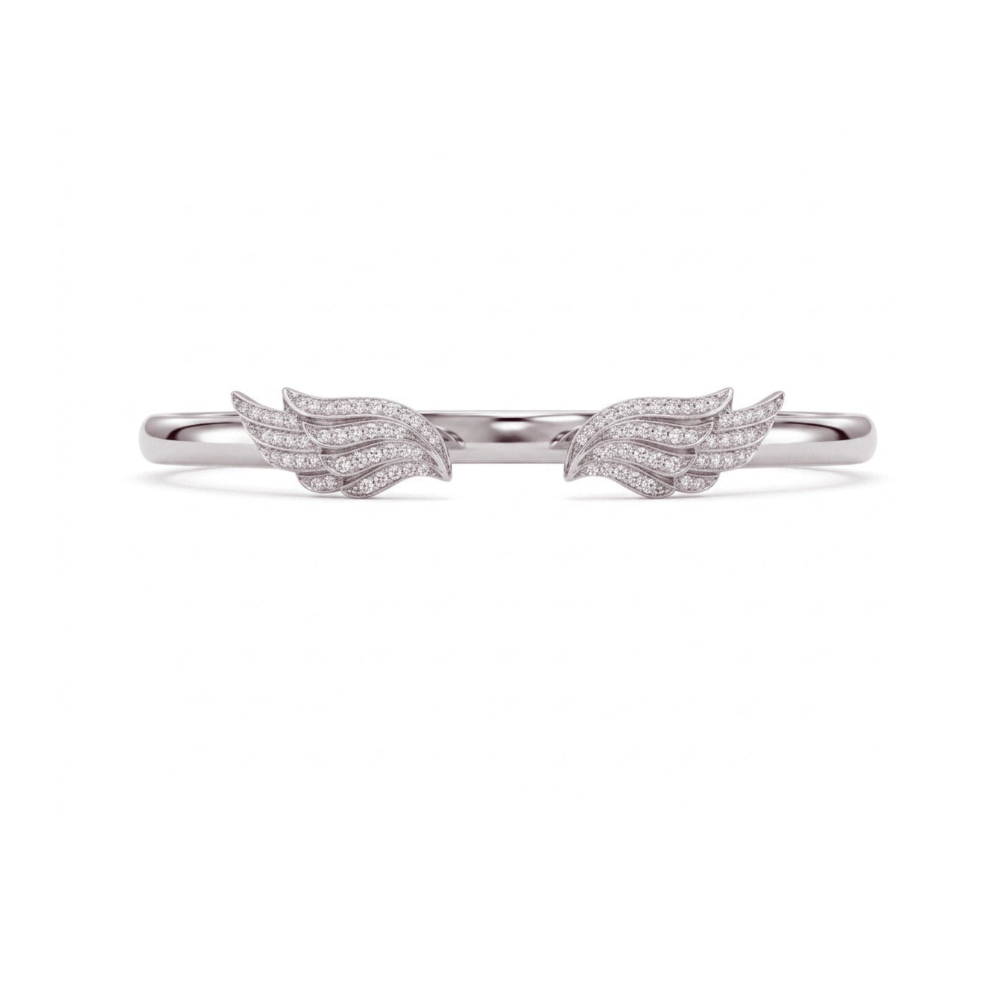 A delicate silver ring featuring two small wing motifs paved with clear stones, centered on a plain white background.