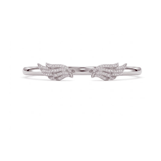 A delicate silver ring featuring two small wing motifs paved with clear stones, centered on a plain white background.