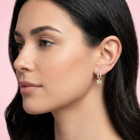 BLOOMTINE Flutterfly gold earrings in 14K gold vermeil. Mini gold hoop earrings with moissanite butterfly charms. Tarnish-resistant and meaningful jewelry for transformation