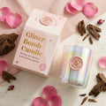 BLOOMTINE Glitter Bomb scented gift candle in an opulent pink glass jar. A luxury rose oud candle made with natural soy wax that reveals a shimmering pool of iridescent sparkle