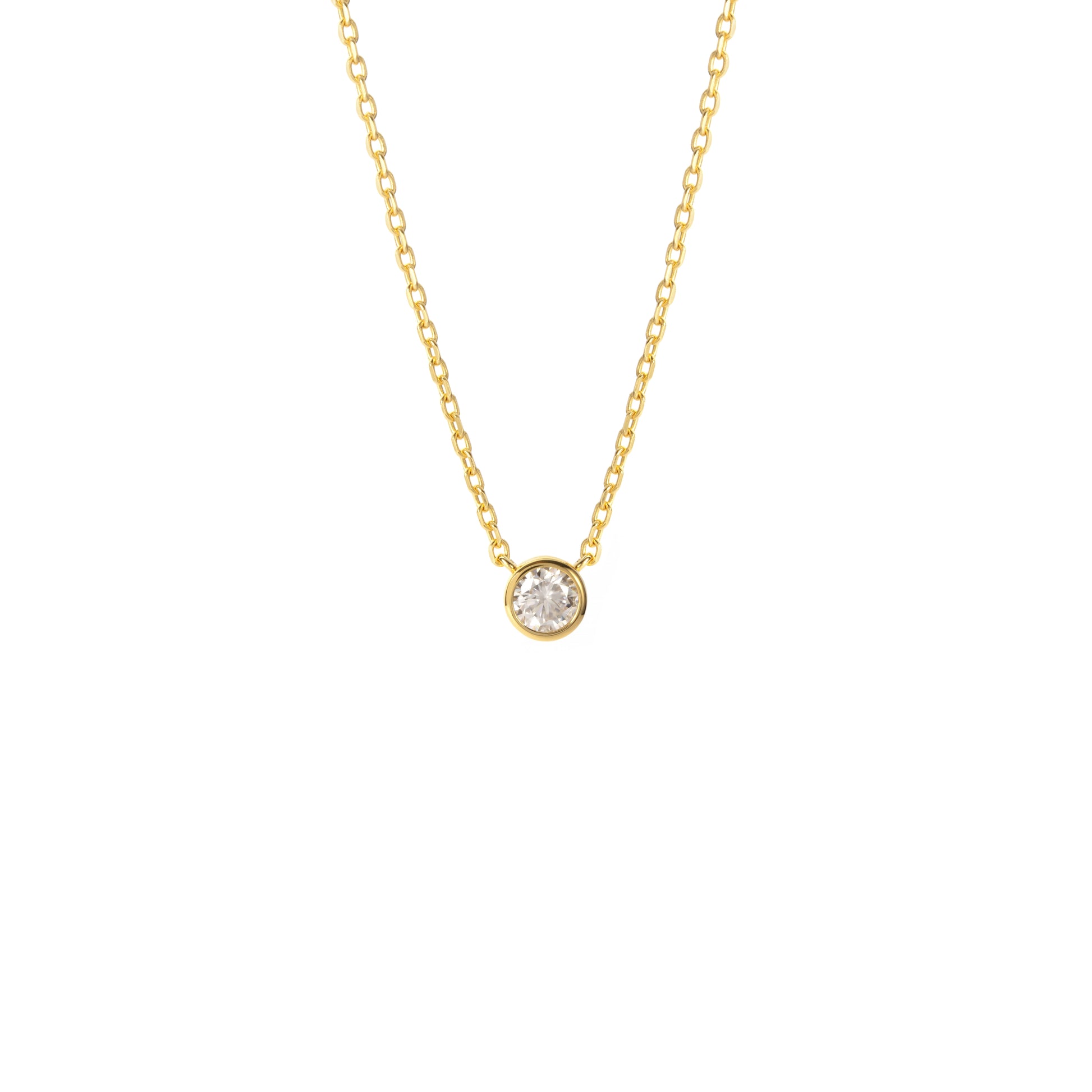 A BLOOMTINE Illuminess™ Gold Necklace featuring a small round-cut lab moissanite pendant. The brilliant-cut stone is set in premium 18k gold-plated sterling silver, shown flat against a white background to highlight the warm luster and 'Extraordinary Human' craftsmanship