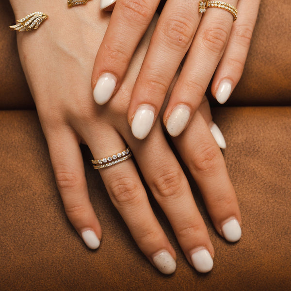 A Bloomtine signature 925 sterling silver ring with brilliant-cut lab moissanites. This tarnish-resistant, rhodium-plated 'Combi' design features a copyrighted architecture that mimics a multi-ring stack. An ethical luxury jewelry piece available at Wolf & Badger and House of Fraser
