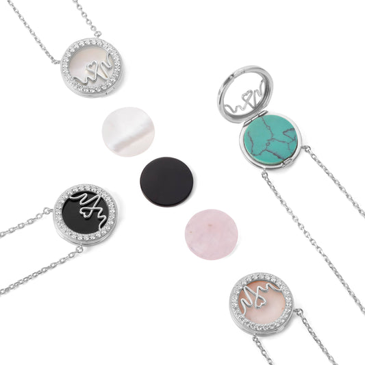 Bloomtine-set-of-necklaces-with-round-pendants. A professional-product-arrangement of multiple-necklaces heart-featuring circular-medallion-charms on a crisp-white-background. This-collection includes-both-18kt-gold-vermeil and 925-sterling-silver-options, showcasing minimalist-round-pendants on fine-adjustable-chains. Ideal-for-jewellery-layering, these-versatile-necklaces are designed-for-gifting and highlight the-polished-finish and botanical-engravings of the-Bloomtine-signature-collection