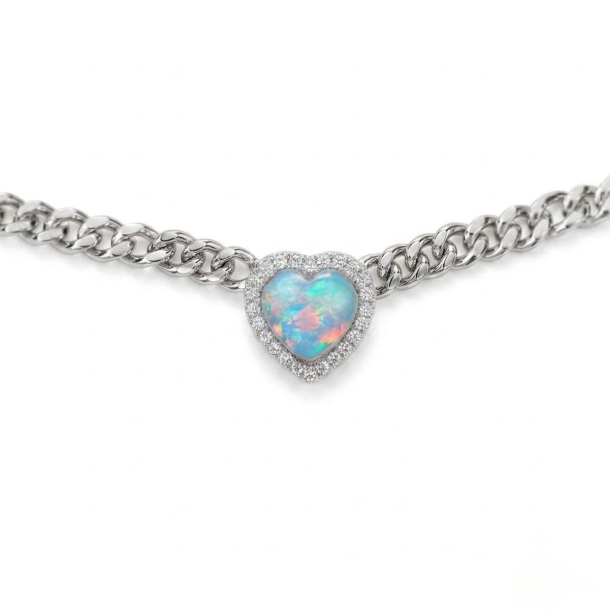 A silver-tone chain bracelet featuring a heart-shaped opal pendant with a halo of small clear stones, shown against a plain white background.