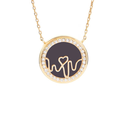 Loves-Frequency-gold-vermeil-heartbeat-locket. A professional-hero-shot of a luxury-18kt-gold-vermeil-heart-locket featuring an-intricate-heartbeat-rhythm-design embellished-with-multiple-shimmering-gemstones. The-pendant is displayed-on-a-clean-white-background, highlighting the-rich-golden-glow and fine-engraved-details. As-the-signature-piece of the Loves-Frequency-collection, this-gemstone-locket is a-meaningful-gift for anniversaries or Valentine’s-Day, combining-premium-materials with deep-emotional-s