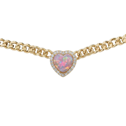 A gold chain necklace featuring a heart-shaped opal pendant with a halo of small clear stones, shown against a plain white background.