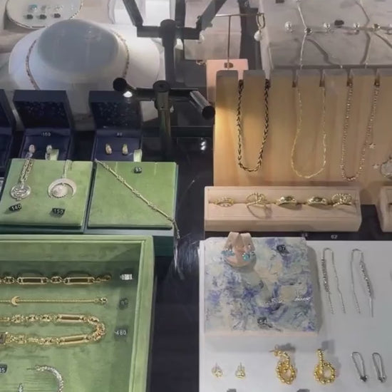 Bloomtine-Mini-Halo-Wings-sterling-silver-diamond-angel-choker. A professional-retail-shot of the full-Mini-Halo-Wings-collection on display at Wolf-and-Badger. The-image features a-dainty-choker with a-diamond-encrusted-angel-wing-pendant in 925-sterling-silver. Shown-within a-luxury-in-store-setting, this-visual highlights the-entire-angelic-jewellery-range, showcasing the-fine-craftsmanship and spiritual-symbolism that-defines the Bloomtine-brand in a-premium-boutique-environment