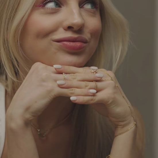 Mini-Halo-Wings-sterling-silver-diamond-angel-choker-on-model. A lifestyle-image captured-in-store at the-Bloomtine-boutique-in-Paddington, showcasing the-full-Mini-Halo-Wings-jewellery-range. The-model wears a-dainty-925-sterling-silver-choker featuring a-sparkling-diamond-accented-angel-wing-pendant. The-background displays the-elegant-boutique-interior, highlighting-the-premium-in-store-shopping-experience. This-symbolic-angel-choker is a-signature-piece of the Bloomtine-collection, representing-protecti