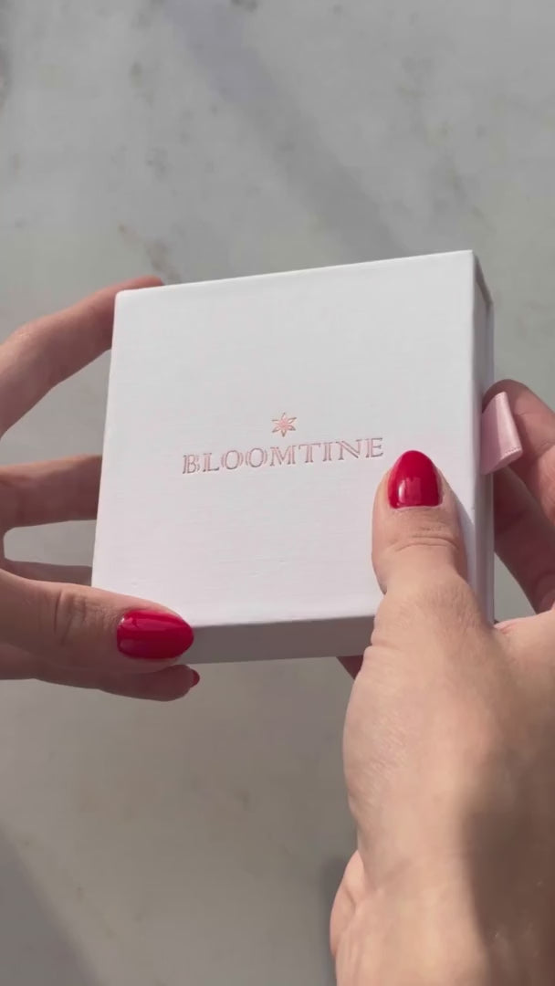 The BLOOMTINE Illuminess™ Starset Bangle in heavy 14K Gold Vermeil. Featuring 4-point and 8-point stars set with brilliant moissanites and an interior 'You are Magic' engraving, this 35g solid silver talisman is designed to manifest abundance and success