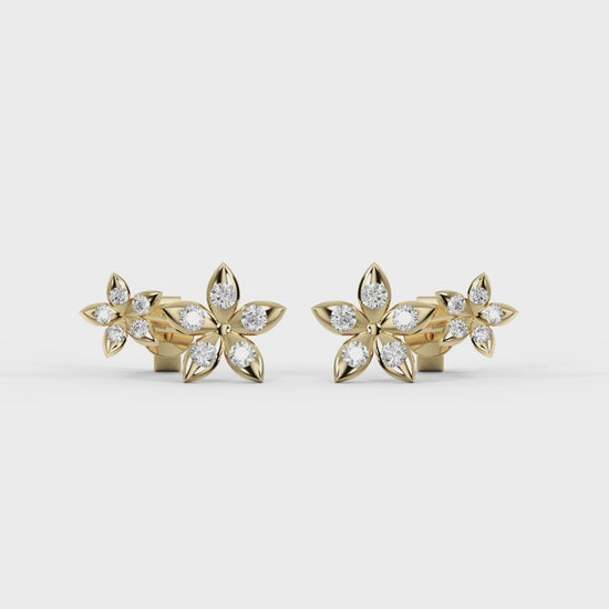 Close-up of a woman wearing a delicate earring with a neutral background. Best_Seller_Bloomtine_Gold_Vermeil_Flower_studs_designed_for_gifting