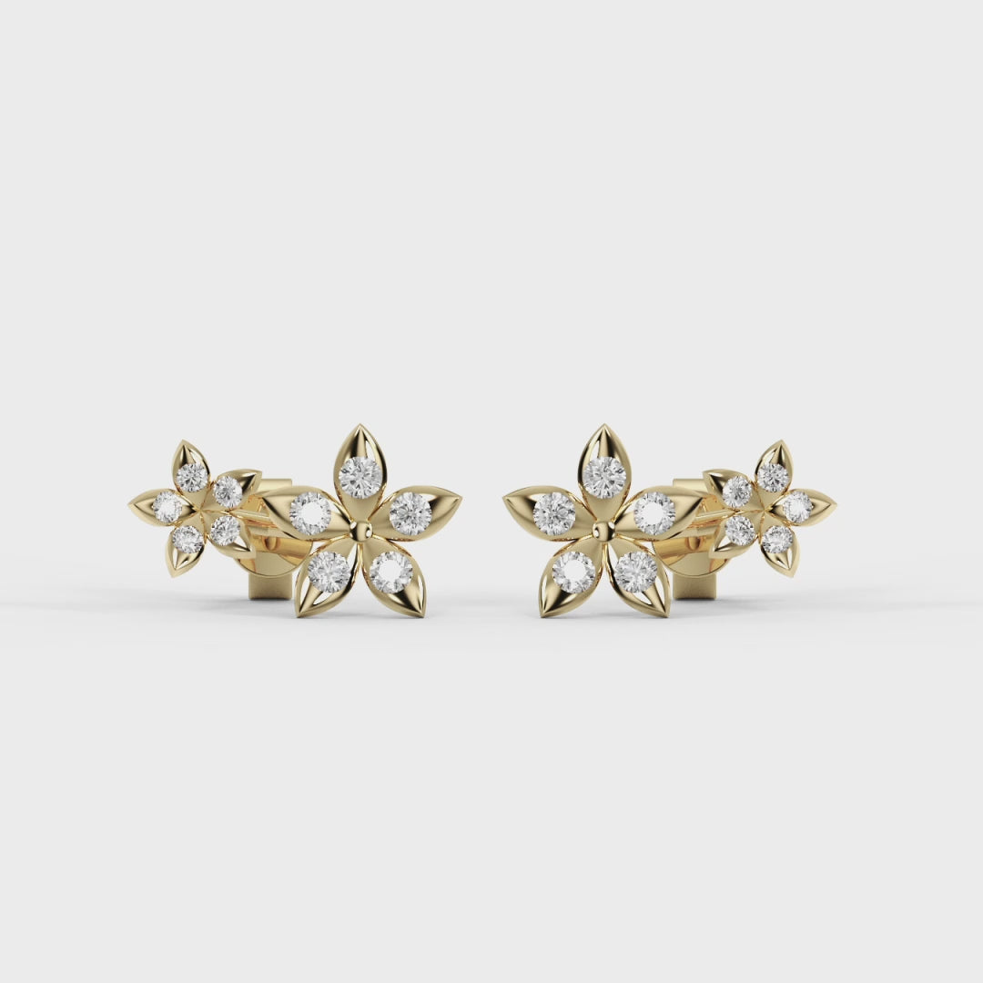 Close-up of a woman wearing a delicate earring with a neutral background. Best_Seller_Bloomtine_Gold_Vermeil_Flower_studs_designed_for_gifting