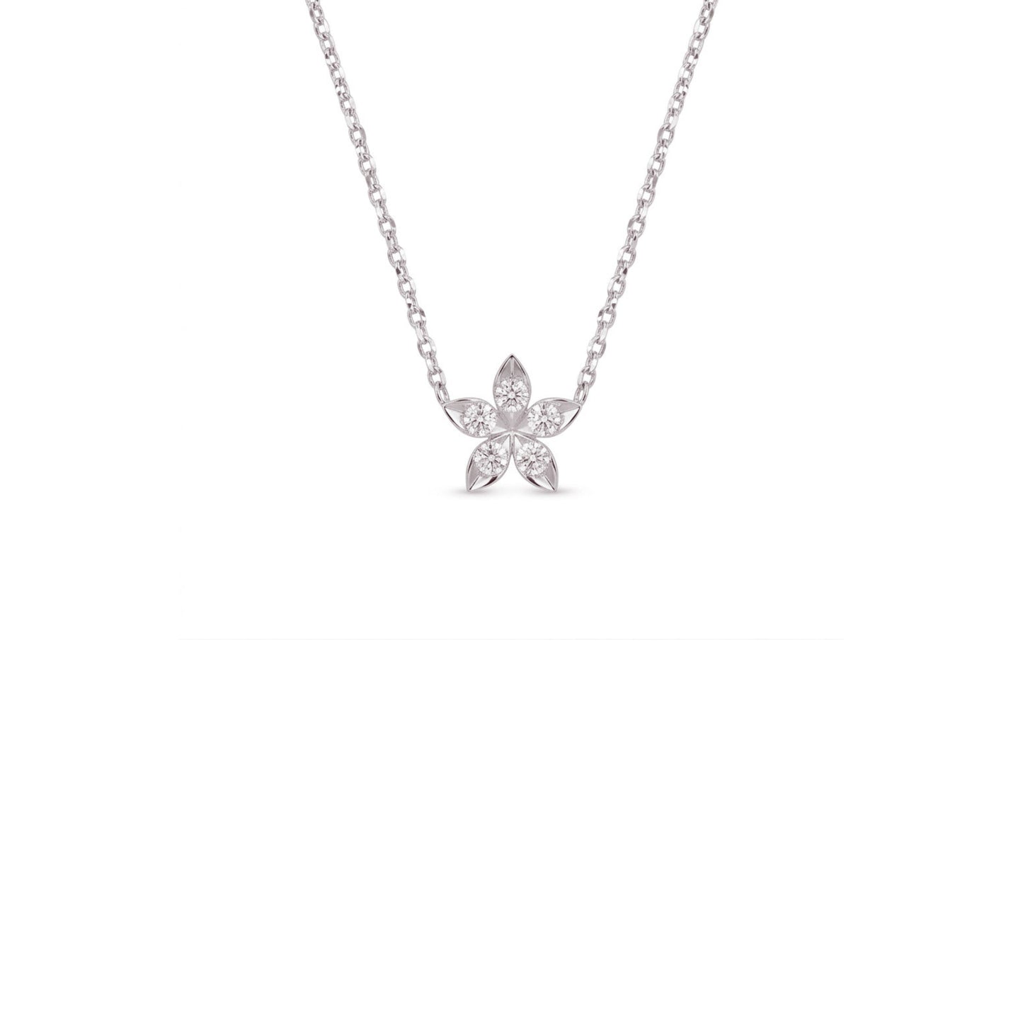 A delicate silver chain necklace with a small flower-shaped pendant set with clear stones, centered against a solid white background.