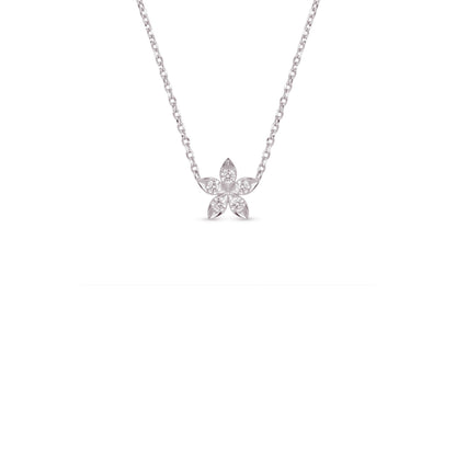 A delicate silver chain necklace with a small flower-shaped pendant set with clear stones, centered against a solid white background.