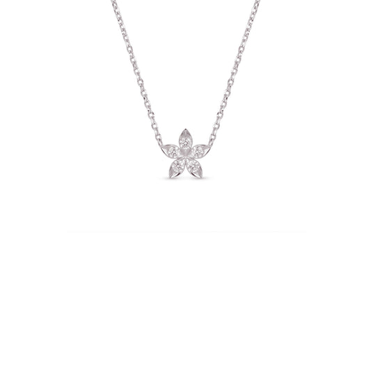 A delicate silver chain necklace with a small flower-shaped pendant set with clear stones, centered against a solid white background.